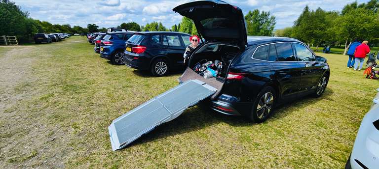 Our adapted car with the ramp extended at Chasewater park. You can just see me with my bright red hair waiting to board! This is the less glamorous side of wheelchair life - the logistics of getting from A to B. Our chariot awaits after a brilliant day out at the plant fair. Wheels to wheels!